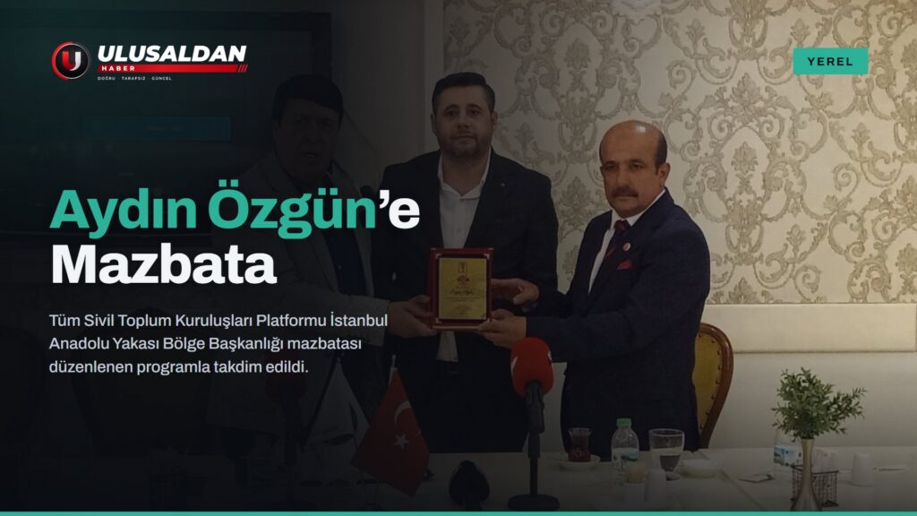 Aydın Özgün’e plaket ve mazbata takdimi sırasında platform yöneticileri